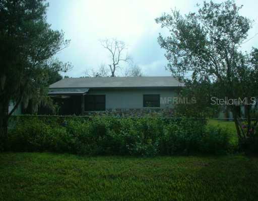 3630 County Line Road Lakeland, FL 33811 - Photo 1 of 1 a front view of a house with garden