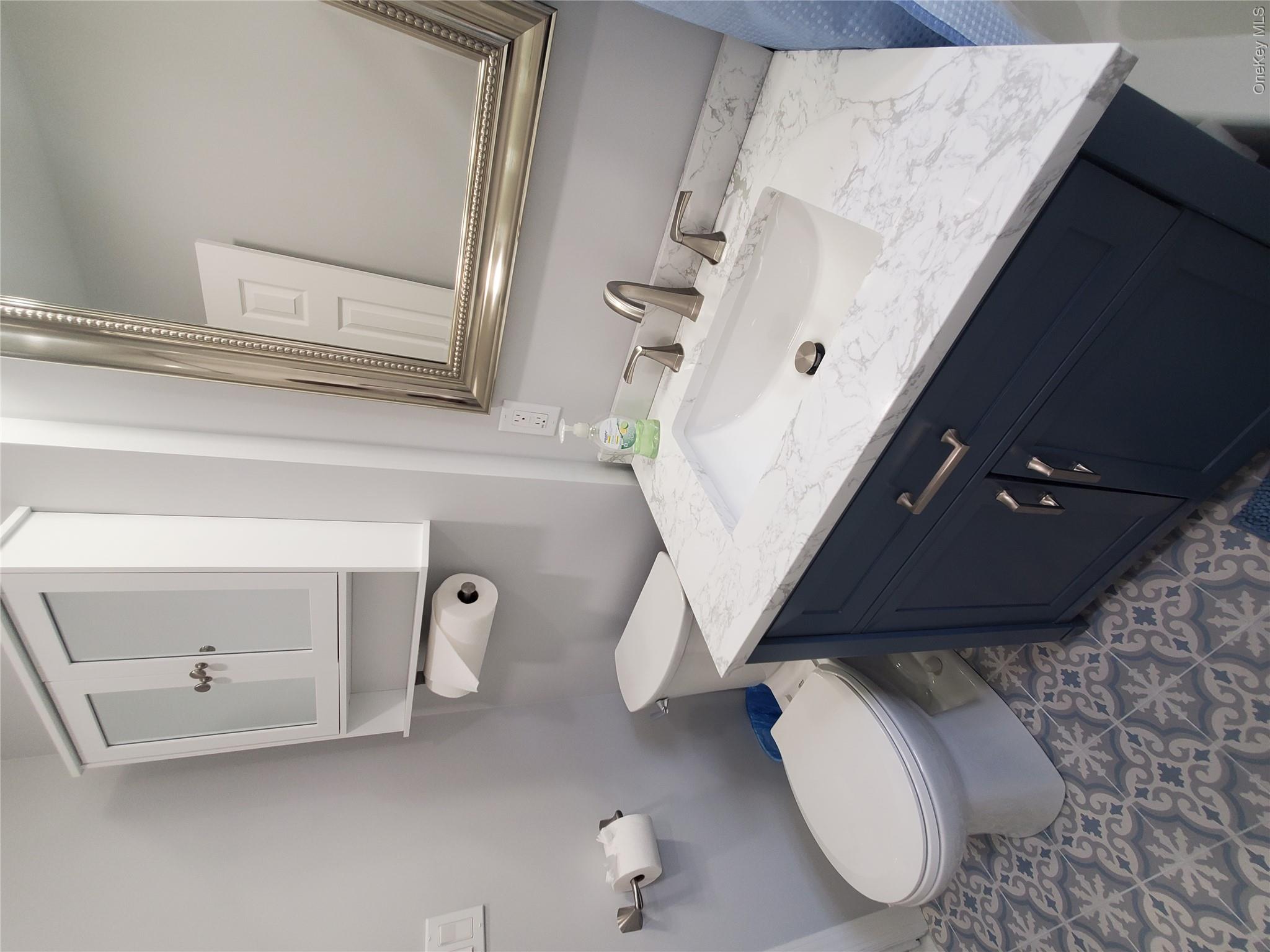 1879 Crompond Road, Unit A21 Peekskill, NY 10566 - Photo 17 of 20 a bathroom with a sink toilet and mirror