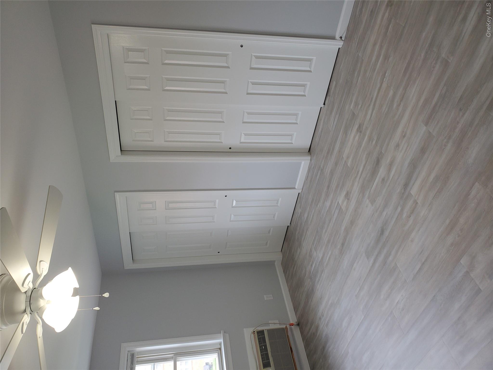 1879 Crompond Road, Unit A21 Peekskill, NY 10566 - Photo 9 of 20 a view of an empty room with wooden floor and a window