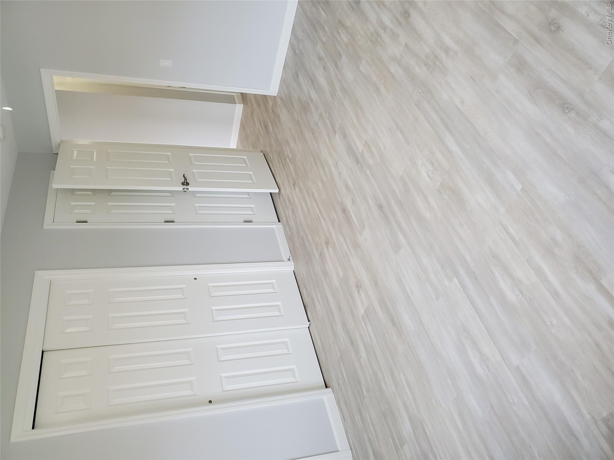 1879 Crompond Road, Unit A21 Peekskill, NY 10566 - Photo 10 of 20 a view of an empty room with wooden floor