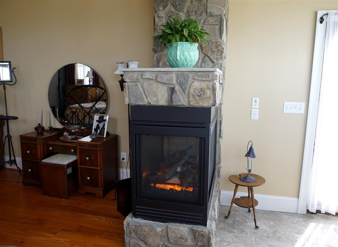 607 Competition Road Raleigh, NC 27603 - Photo 14 of 20 Working gas fireplace in master bedroom