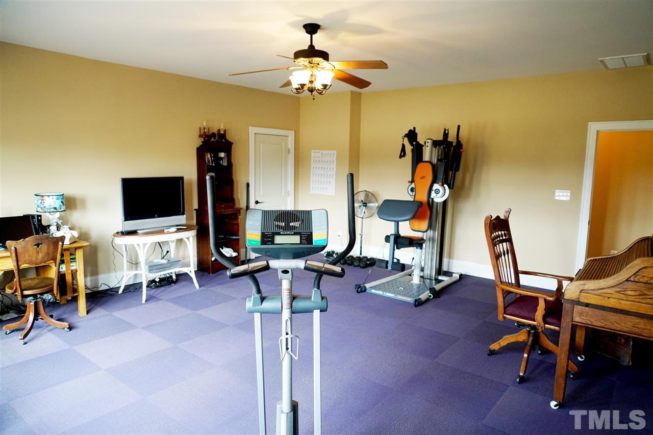 607 Competition Road Raleigh, NC 27603 - Photo 17 of 20 Huge rec room facing front of home; door leads to huge storage area