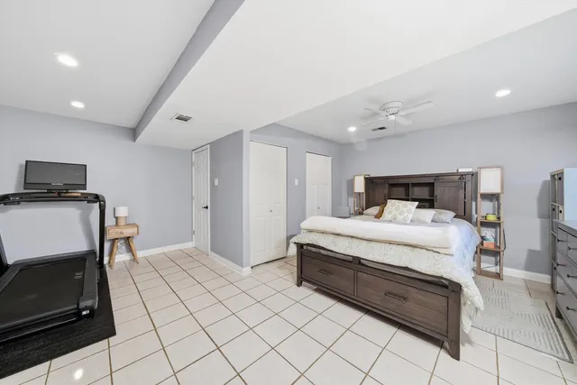 a bedroom with a bed and a tv