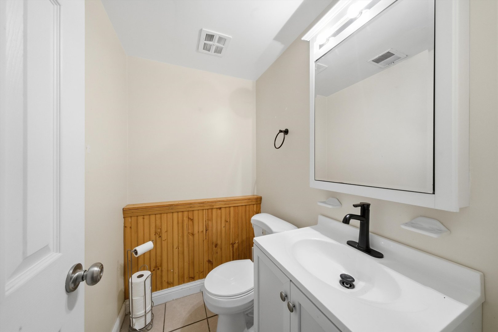 4305 South Wood Street Chicago, IL 60609 - Photo 16 of 22 a bathroom with a sink toilet and mirror