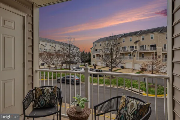 a view of balcony with furniture