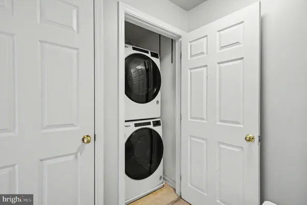 a view of a hallway with washer and dryer