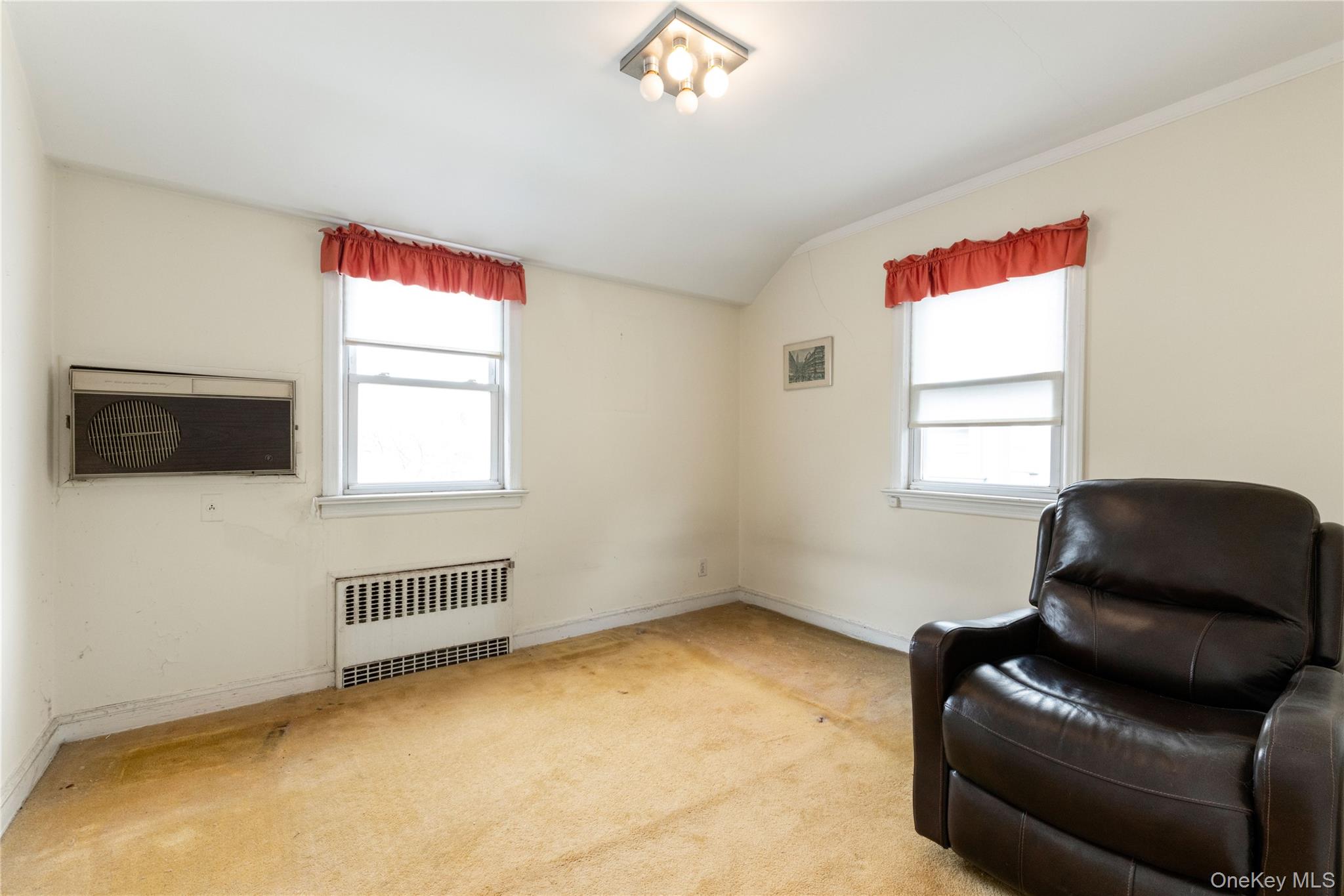 185-47 80th Road Queens, NY 11366 - Photo 11 of 20 a living room with furniture and a window