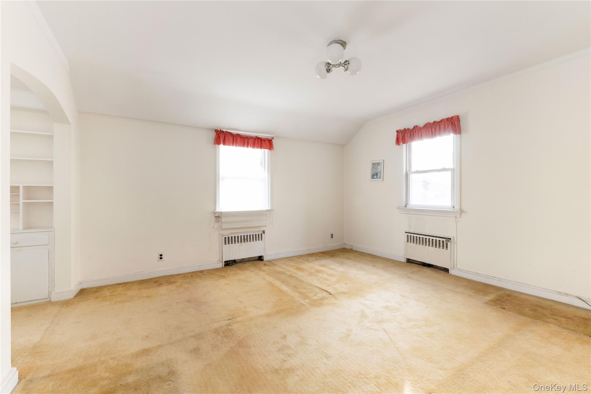 185-47 80th Road Queens, NY 11366 - Photo 12 of 20 an empty room with windows