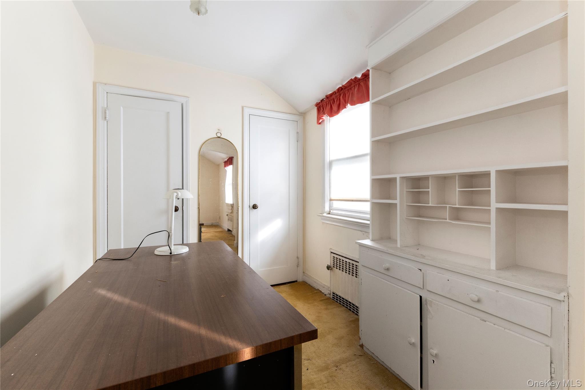 185-47 80th Road Queens, NY 11366 - Photo 14 of 20 a room with a bed and cabinets