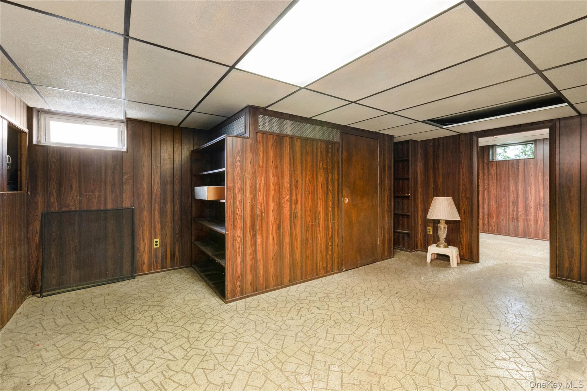185-47 80th Road Queens, NY 11366 - Photo 18 of 20 a view of a livingroom with furniture and a garage