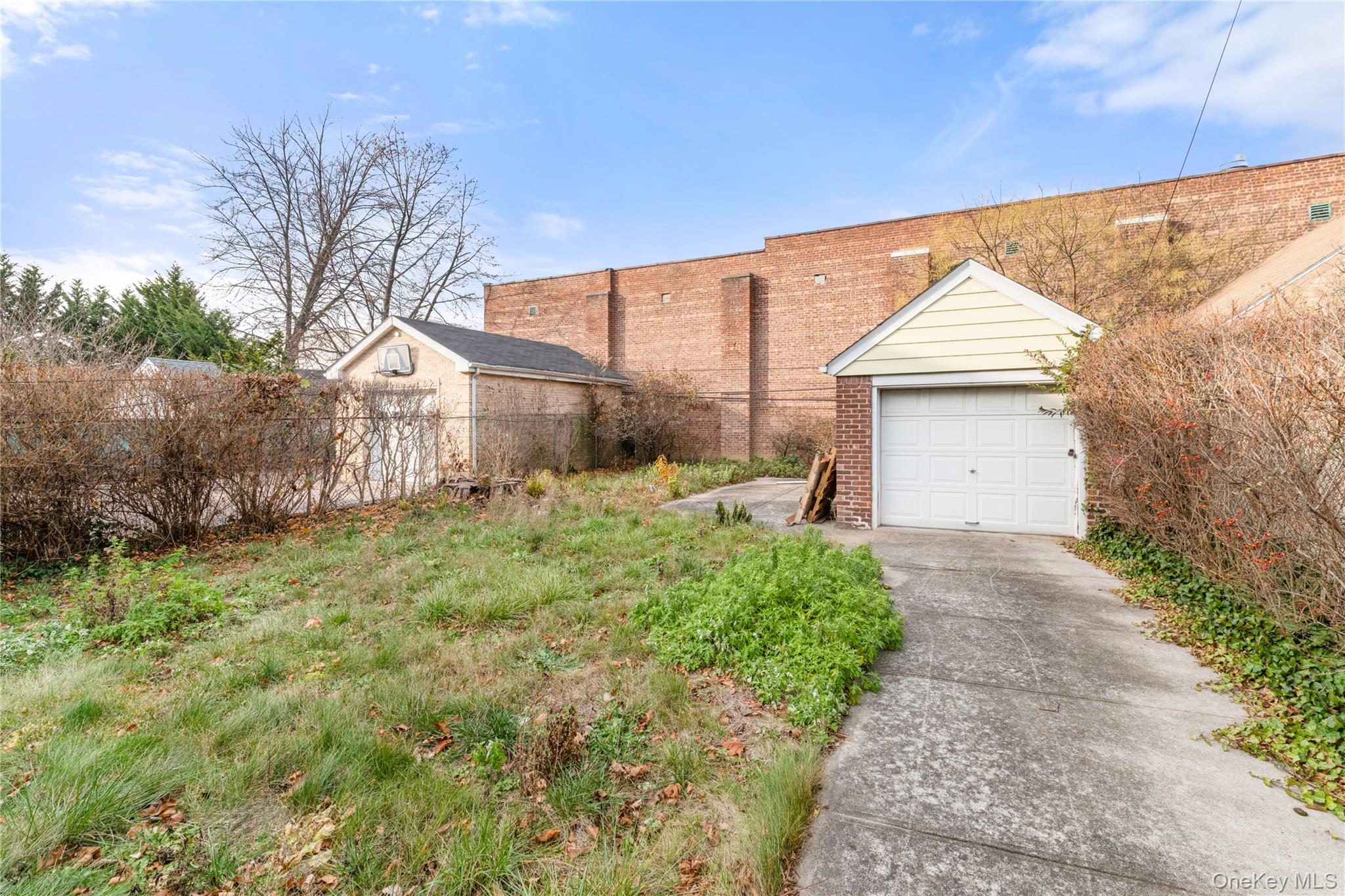 185-47 80th Road Queens, NY 11366 - Photo 19 of 20 a front view of a house with garden