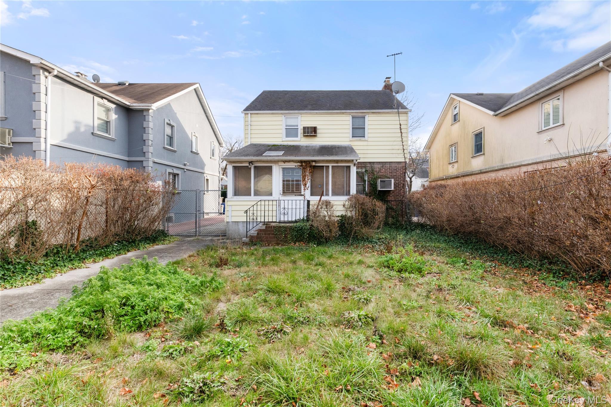 185-47 80th Road Queens, NY 11366 - Photo 20 of 20 a view of a house with backyard and garden