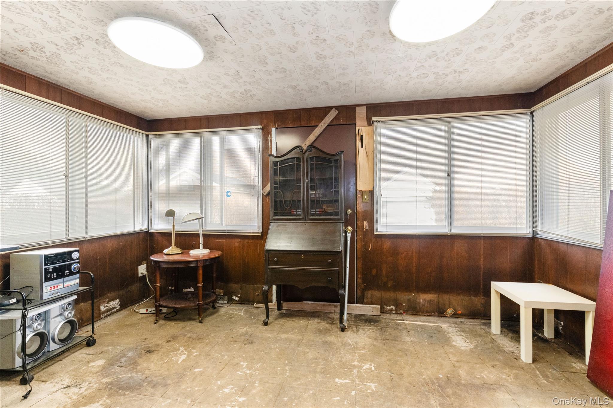 185-47 80th Road Queens, NY 11366 - Photo 8 of 20 a room with furniture and two window