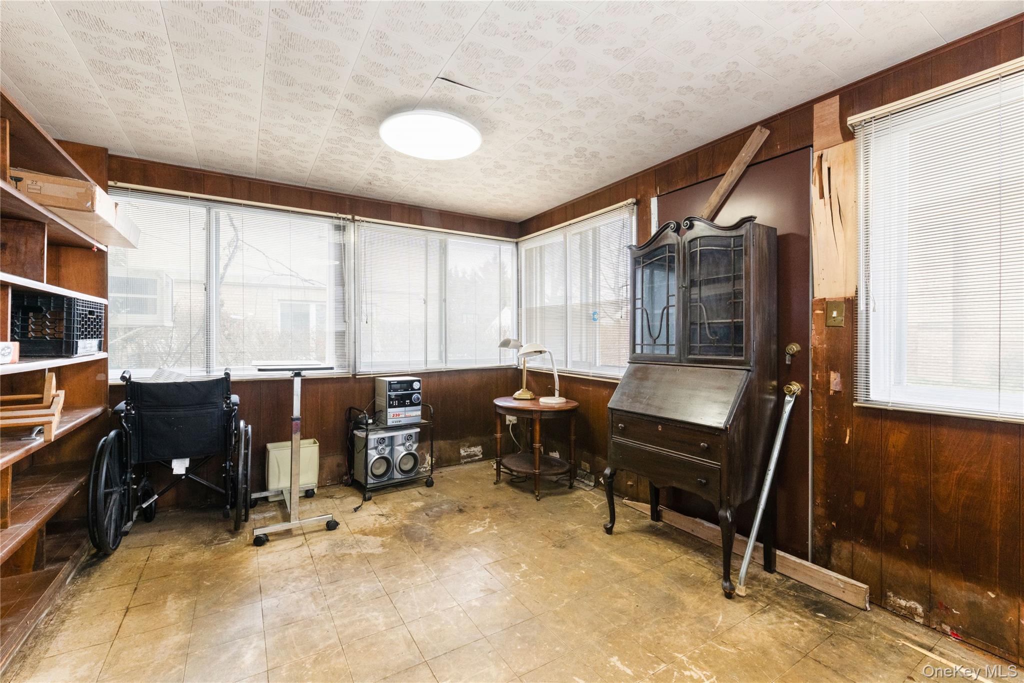 185-47 80th Road Queens, NY 11366 - Photo 9 of 20 a workspace with furniture and a window