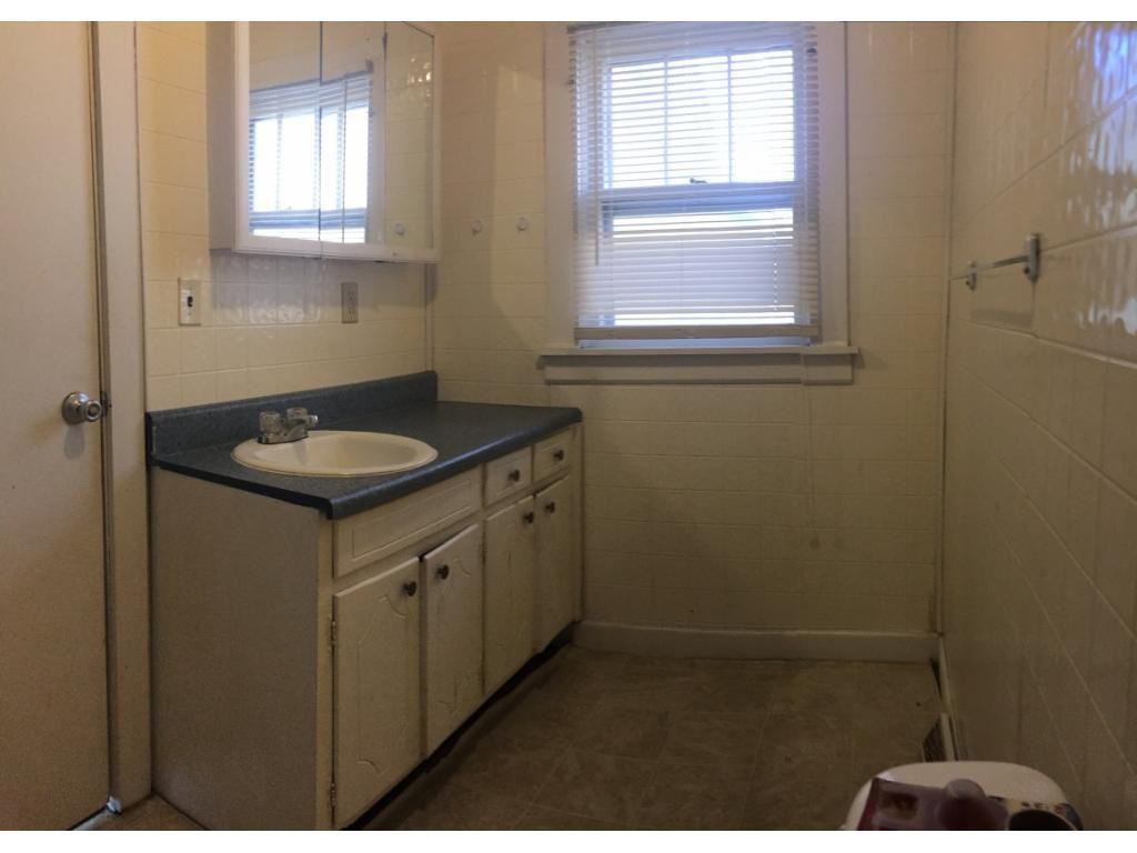 1333 Hampton Road Eden, NC 27288 - Photo 16 of 23 a bathroom with a granite countertop sink and window