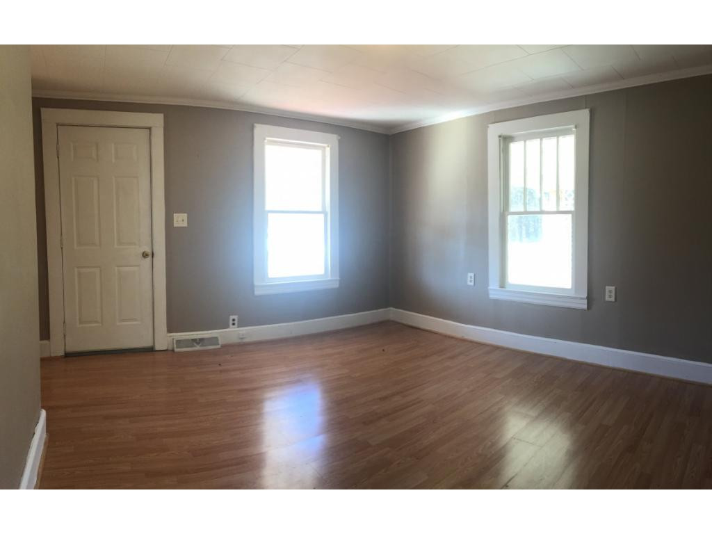 1333 Hampton Road Eden, NC 27288 - Photo 10 of 23 a view of an empty room with wooden floor and a window