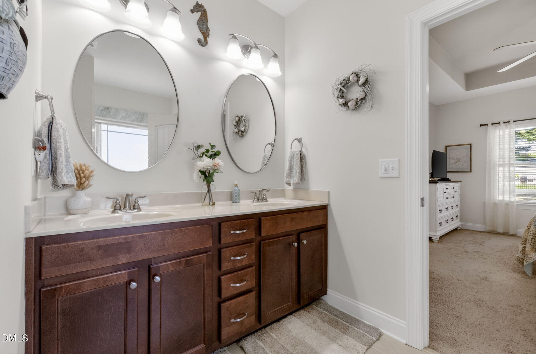 20 Deep Clay Circle Angier, NC 27501 - Photo 32 of 54 a bathroom with a double vanity sink and a mirror