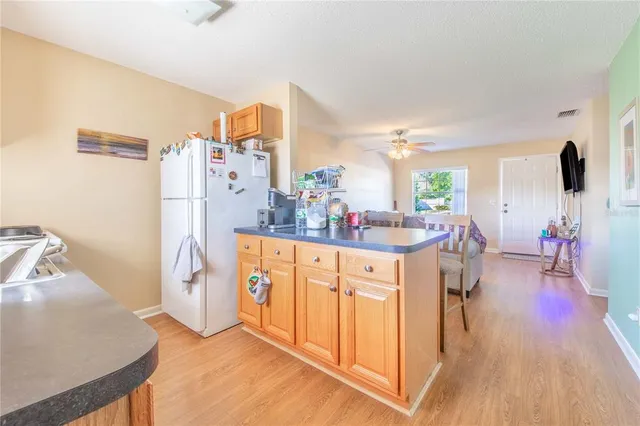 a kitchen with stainless steel appliances a refrigerator and a stove