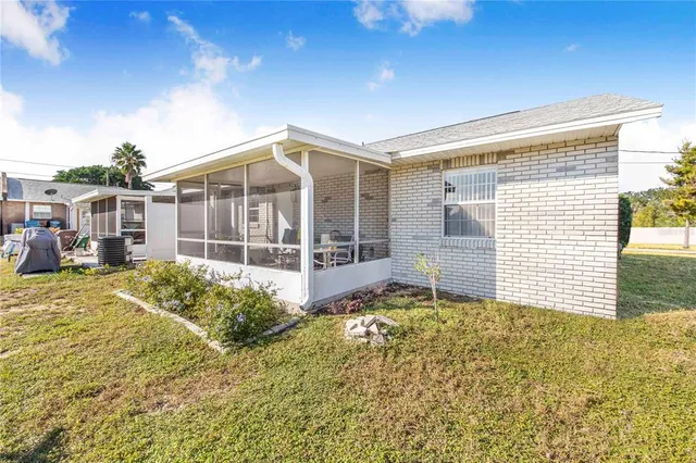 a front view of a house with a large window