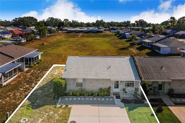 an aerial view of a house with a ocean view