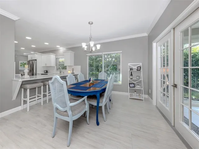 a bedroom with a bed window and a flat screen tv