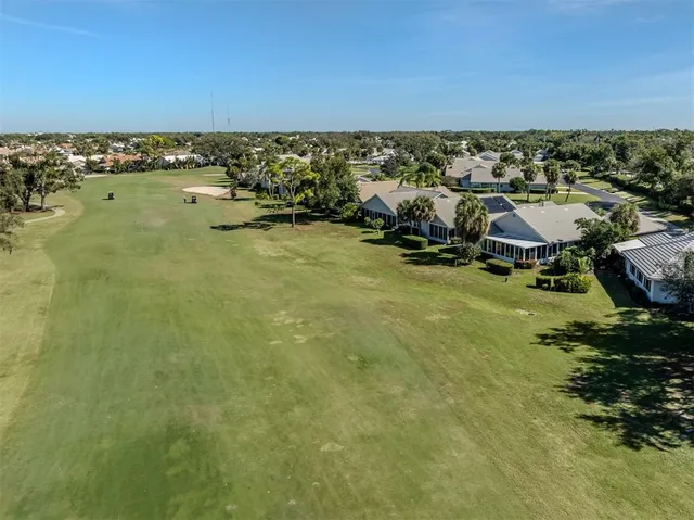 a view of a swimming pool with outdoor seating
