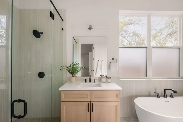 a bathroom with a sink toilet and shower