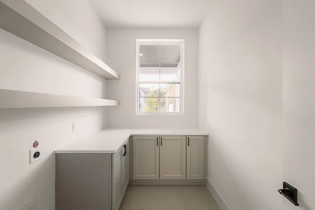 a view of a room with wooden floor and staircase