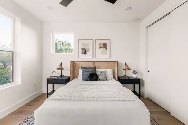 a bedroom with a bed and a window