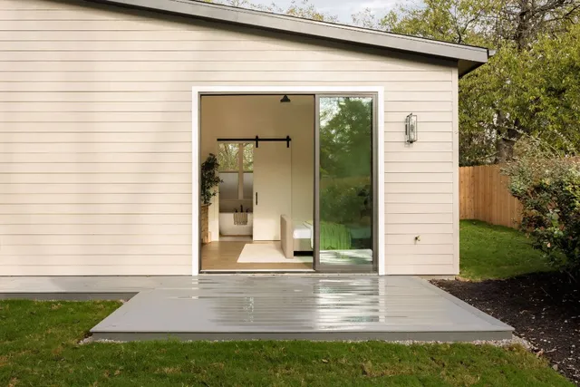 a view of backyard with a garden and plants