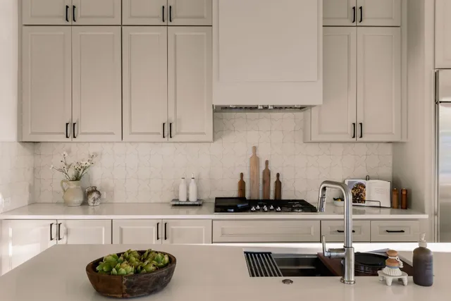 a kitchen with a sink and cabinets