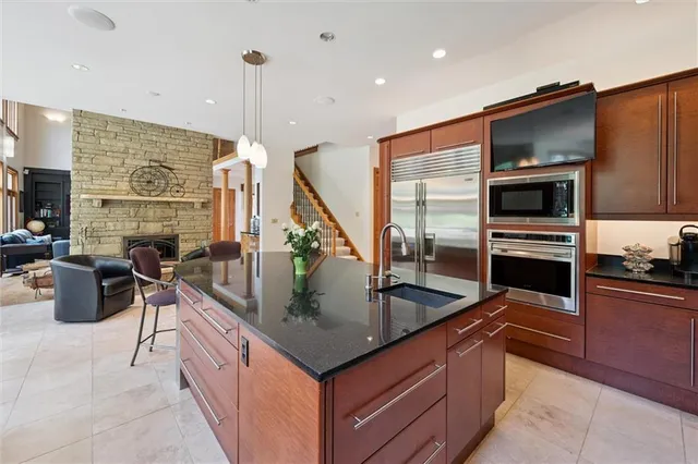 a living room with furniture and large windows