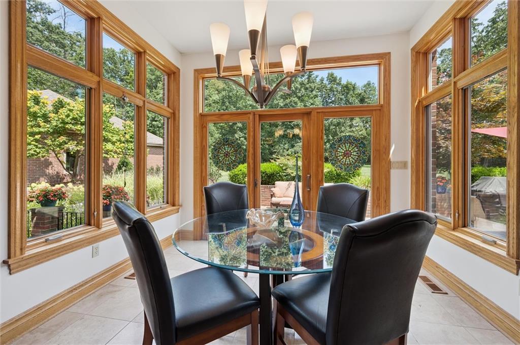 1653 Chapel Ridge Mars, PA 16046 - Photo 15 of 50 a view of a dining room with furniture large windows and wooden floor