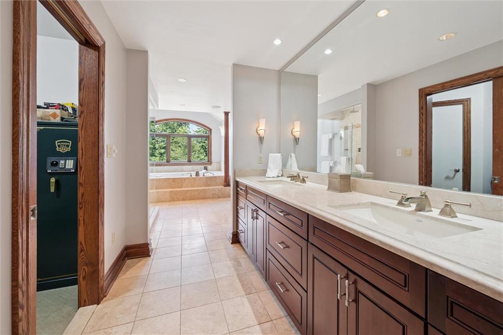 1653 Chapel Ridge Mars, PA 16046 - Photo 19 of 50 a spacious bathroom with a granite countertop sink shower and a mirror