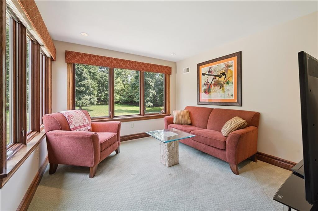 1653 Chapel Ridge Mars, PA 16046 - Photo 21 of 50 a living room with furniture and a large window
