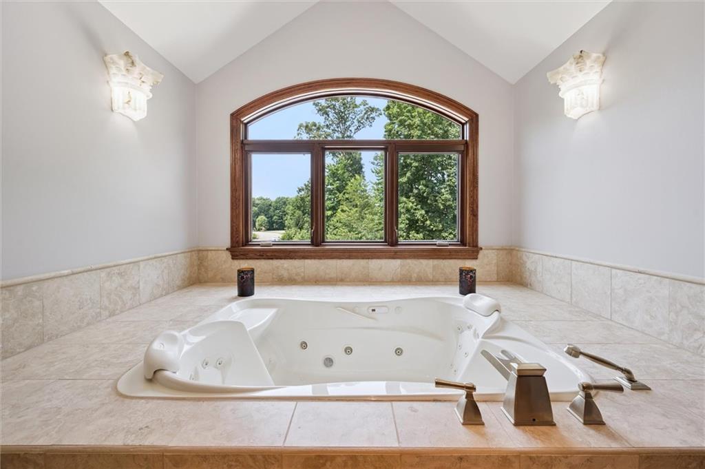 1653 Chapel Ridge Mars, PA 16046 - Photo 23 of 50 a bath tub sitting in a bathroom next to a window