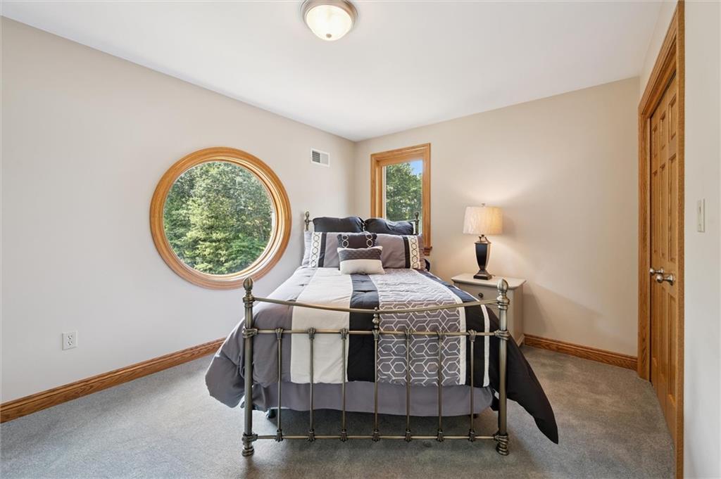 1653 Chapel Ridge Mars, PA 16046 - Photo 27 of 50 a bed sitting in a bedroom next to a window