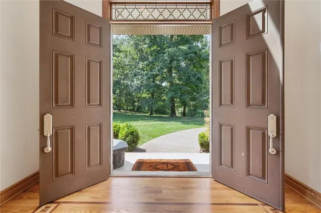 a view of entryway dining room and hall with wooden floor