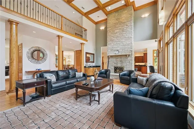 a kitchen with stainless steel appliances granite countertop a kitchen island a table and chairs