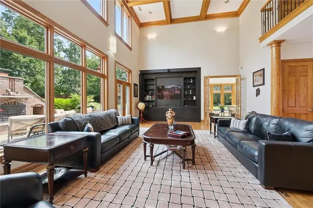 a kitchen with stainless steel appliances granite countertop a sink a stove and a refrigerator