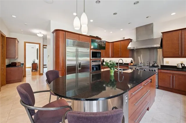 a view of a dining room with furniture large windows and wooden floor