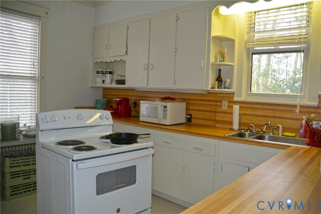 900 High Street Farmville, VA 23901 - Photo 12 of 24 Kitchen featuring white cabinetry, wood-finish cou