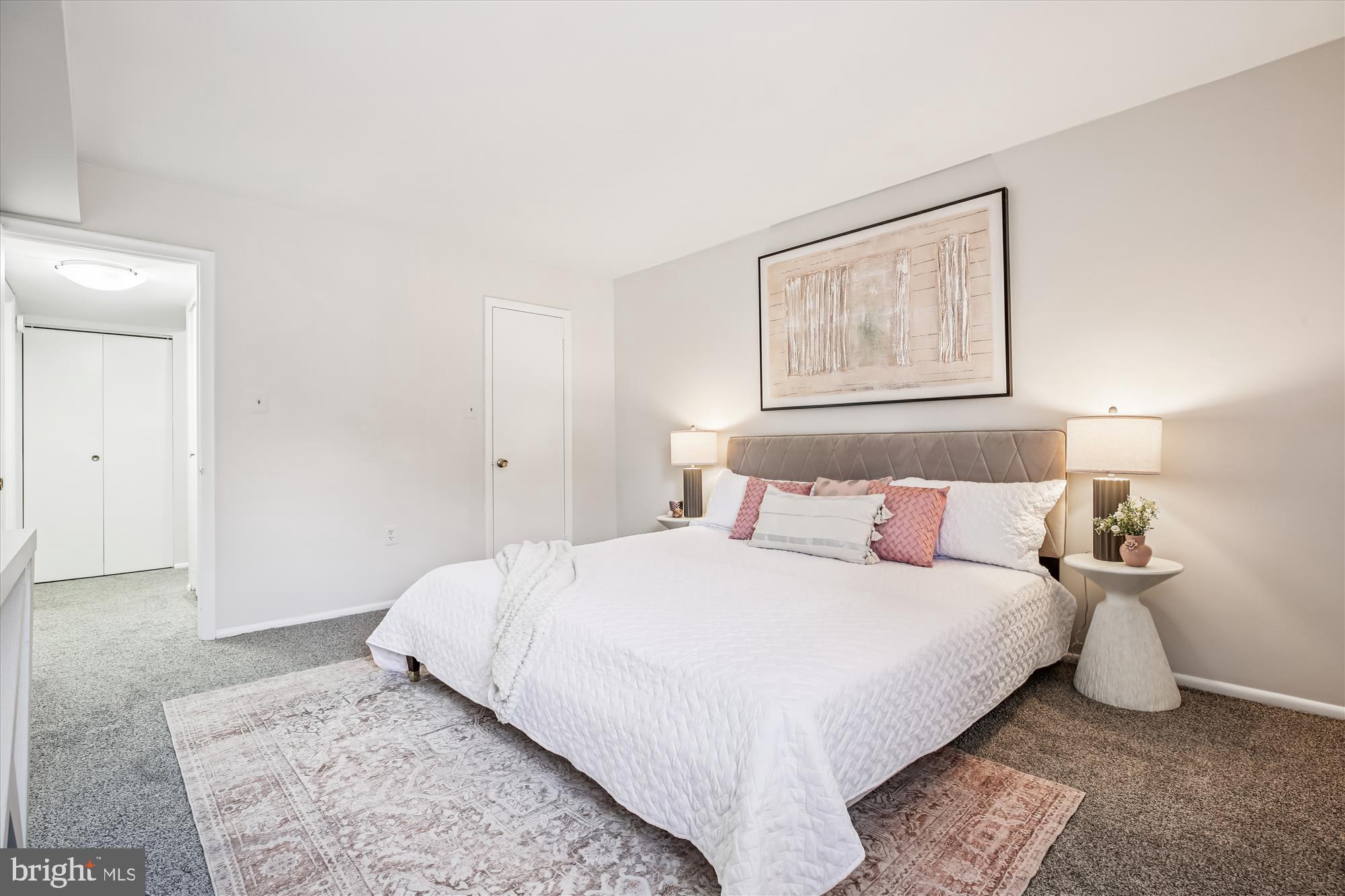 14410 Parkvale Road, Unit 2 Rockville, MD 20853 - Photo 14 of 37 a bedroom with a bed and a painting on the wall