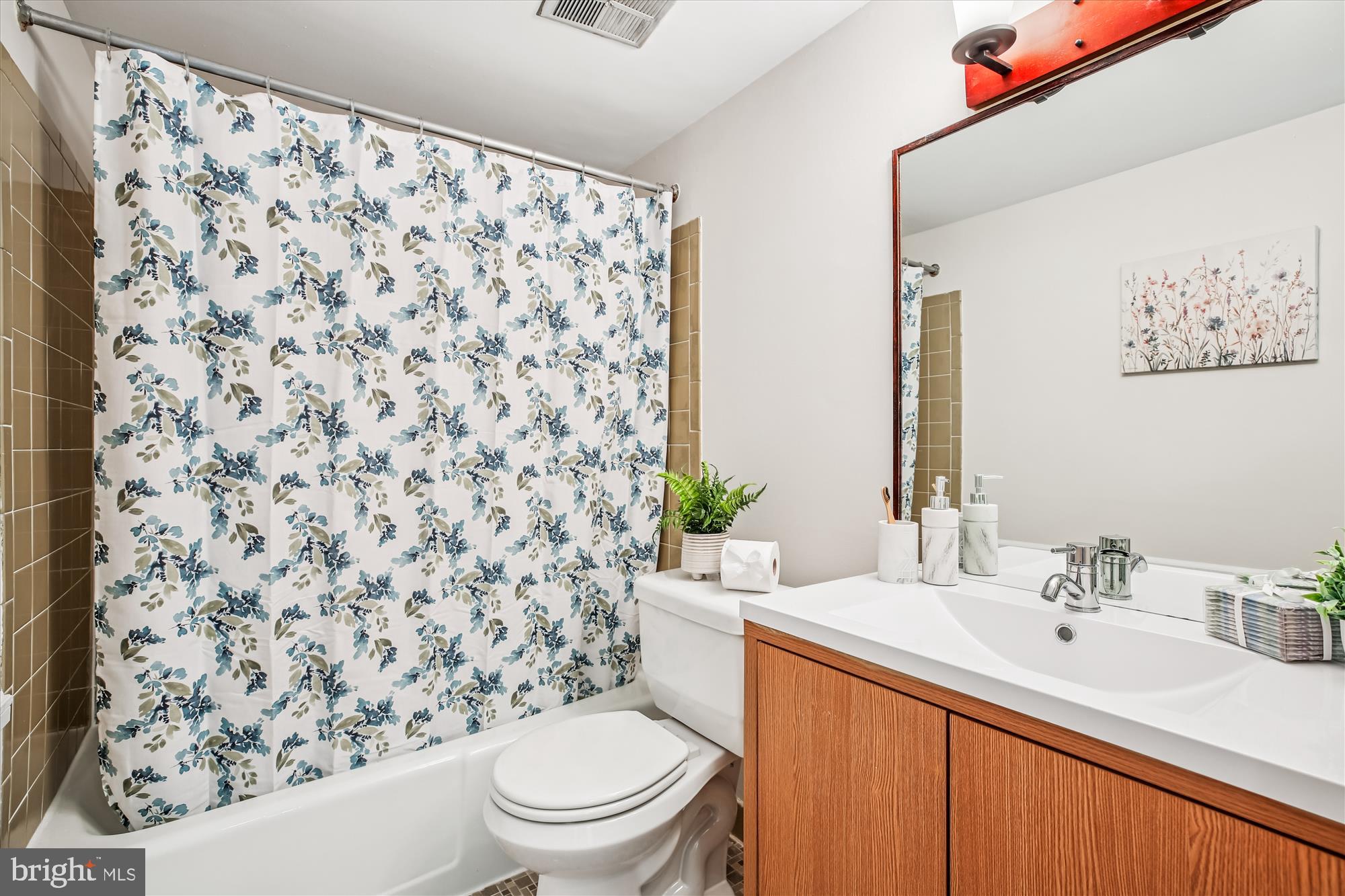 14410 Parkvale Road, Unit 2 Rockville, MD 20853 - Photo 16 of 37 a bathroom with a sink toilet and shower