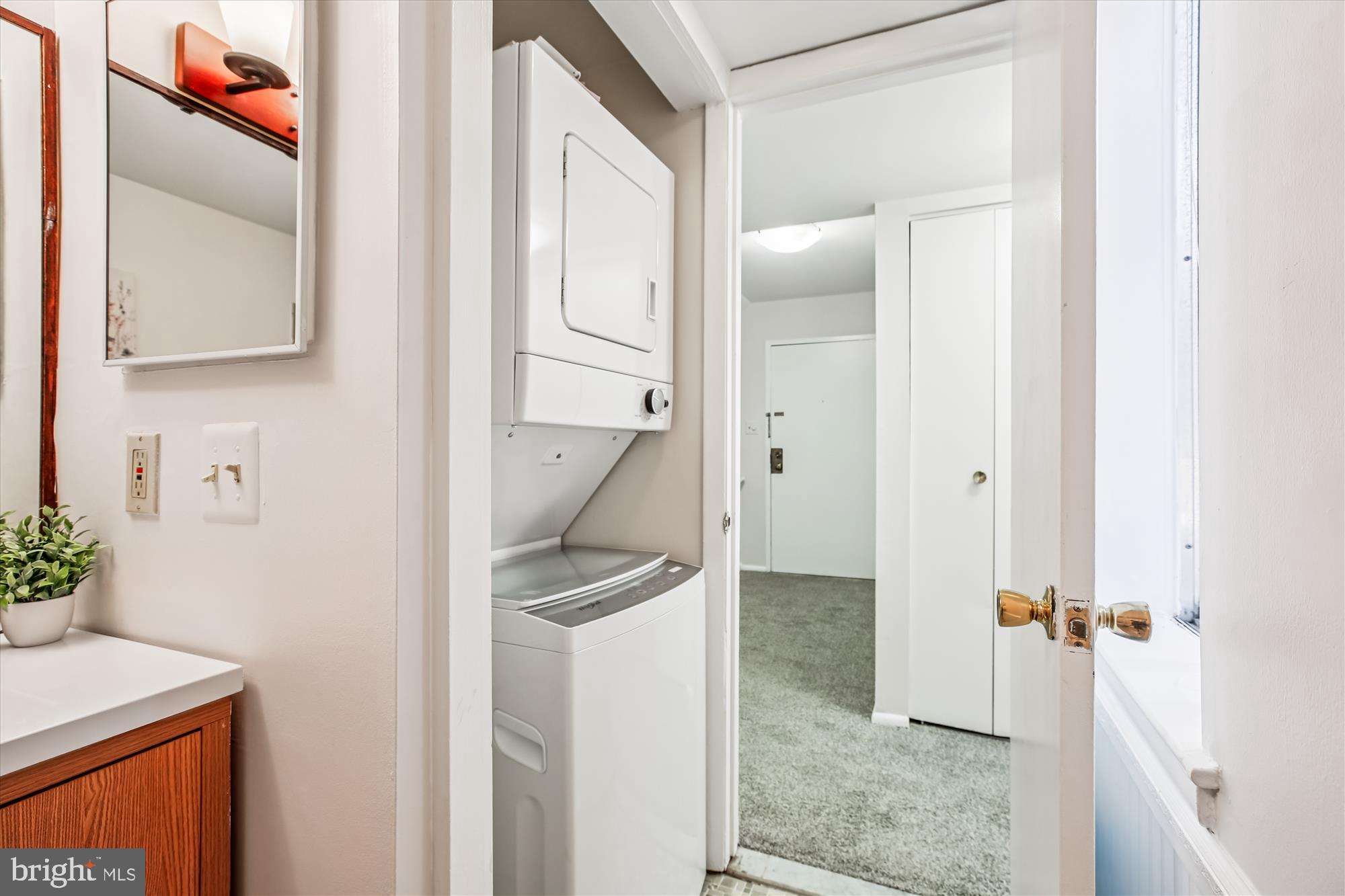14410 Parkvale Road, Unit 2 Rockville, MD 20853 - Photo 17 of 37 a view of hallway with sink and wooden floor