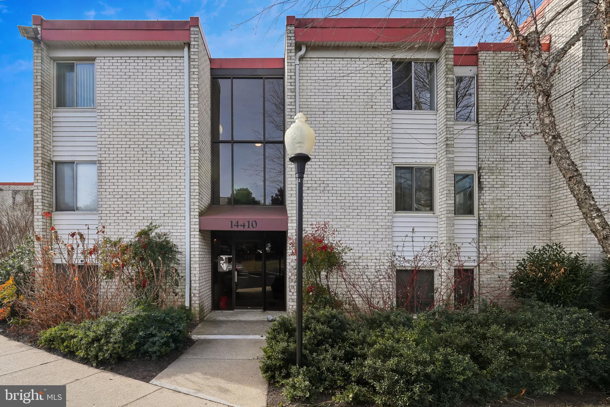 14410 Parkvale Road, Unit 2 Rockville, MD 20853 - Photo 2 of 37 a front view of a house with plants