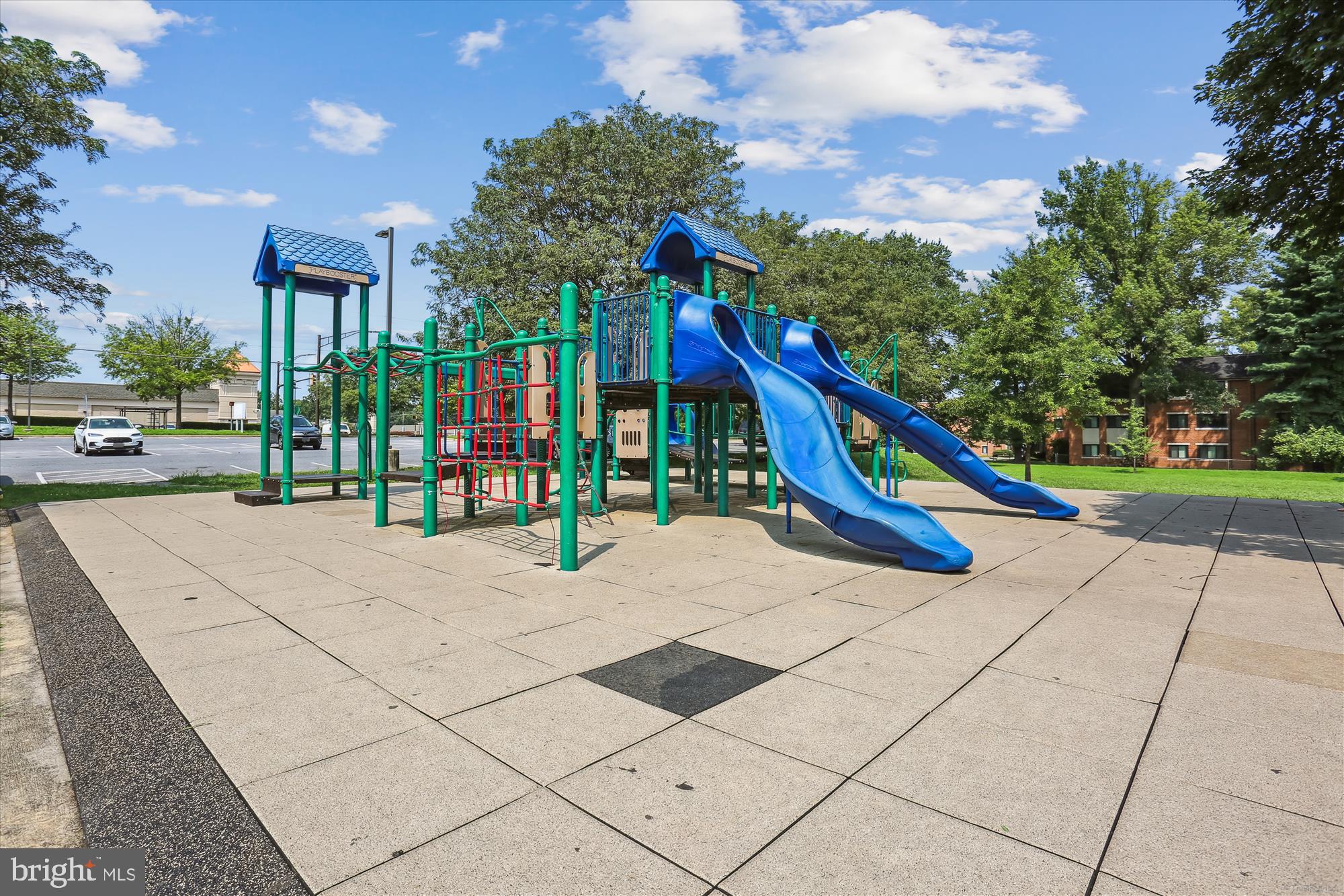 14410 Parkvale Road, Unit 2 Rockville, MD 20853 - Photo 22 of 37 a view of a park with swings and slides
