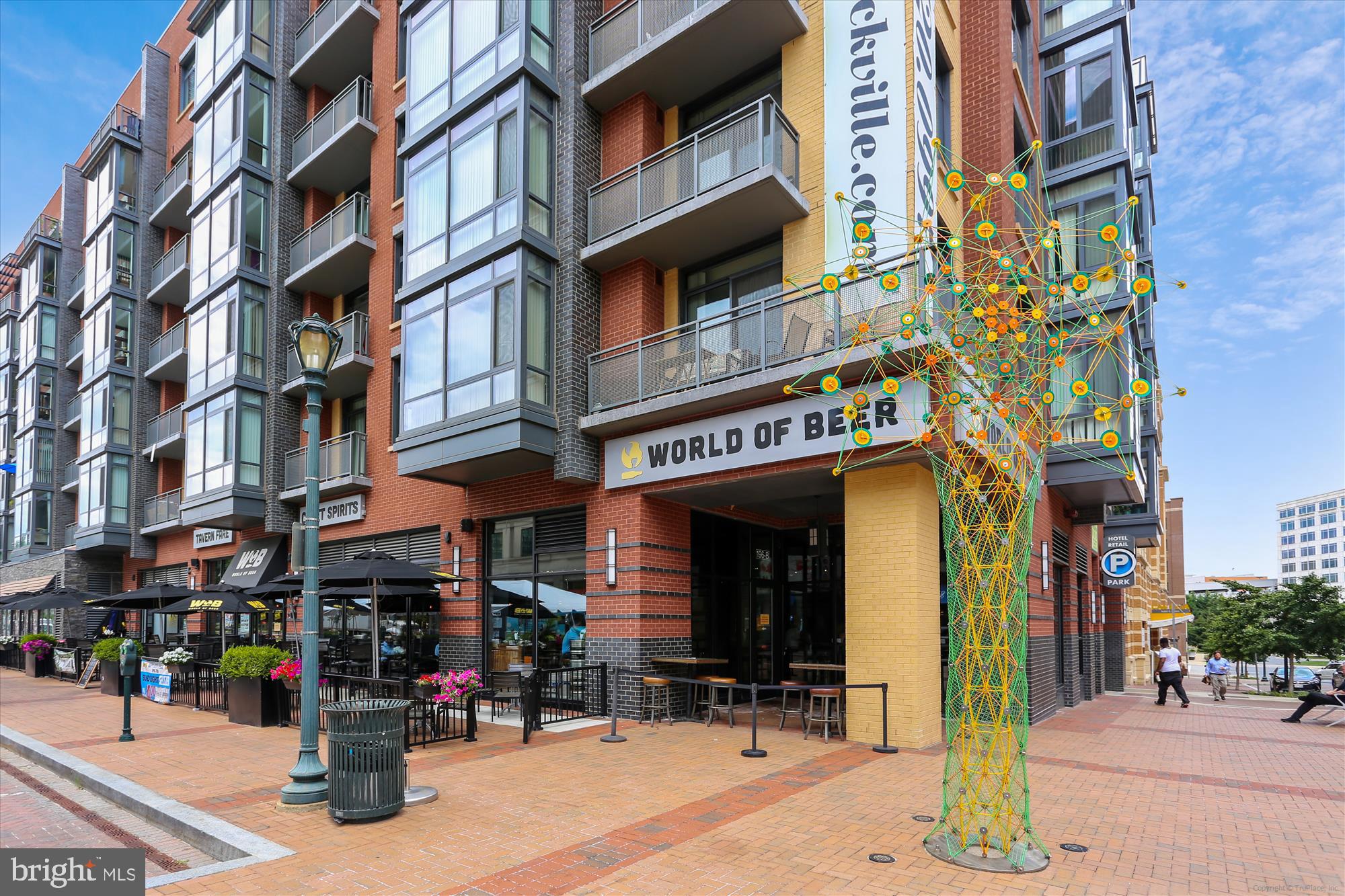 14410 Parkvale Road, Unit 2 Rockville, MD 20853 - Photo 32 of 37 a view of a building with a people on a street