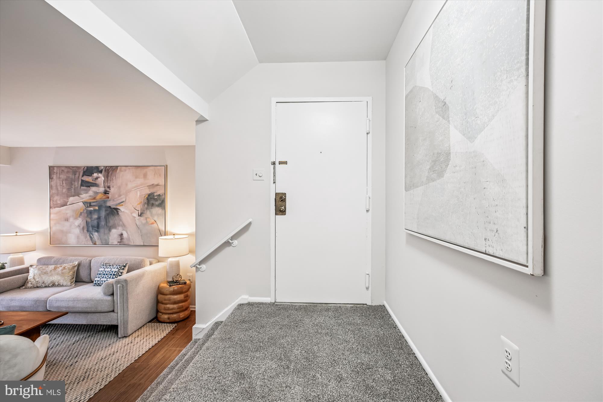 14410 Parkvale Road, Unit 2 Rockville, MD 20853 - Photo 4 of 37 a living room with furniture and a painting on the wall