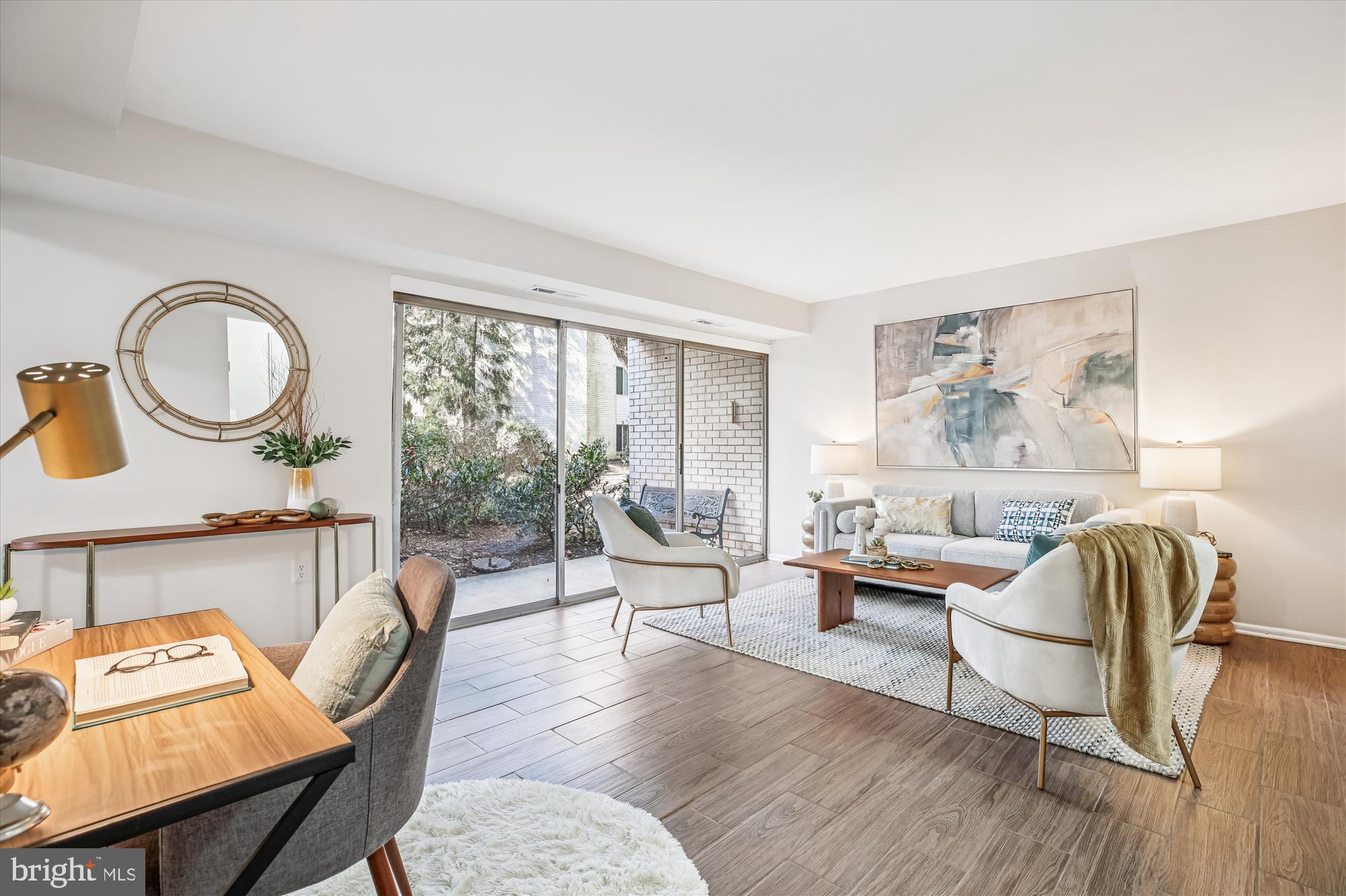 14410 Parkvale Road, Unit 2 Rockville, MD 20853 - Photo 5 of 37 a living room with furniture and a large window